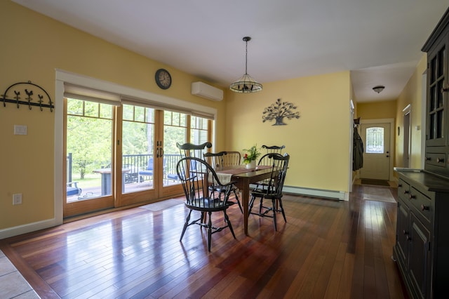 15 Brookview Dr, Bucksport, ME 04416 - dining area featuring a baseboard heating unit, a wall mounted air conditioner, french doors, and dark wood finished floors