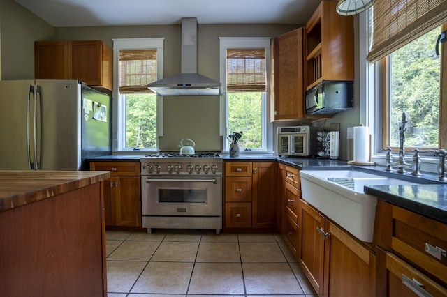 15 Brookview Dr, Bucksport, ME 04416 - kitchen featuring wall chimney range hood, appliances with stainless steel finishes, and plenty of natural light