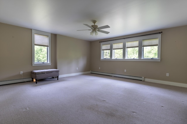15 Brookview Dr, Bucksport, ME 04416 - spare room featuring a baseboard radiator, a ceiling fan, and carpet floors