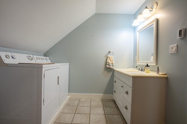 15 Brookview Dr, Bucksport, ME 04416 - bathroom featuring separate washer and dryer, vaulted ceiling, vanity, baseboards, and tile patterned floors