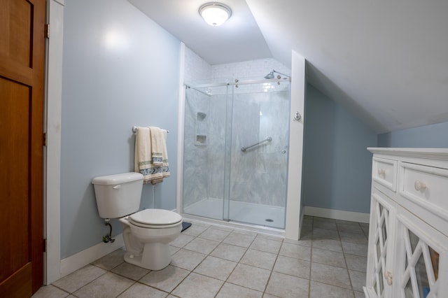 15 Brookview Dr, Bucksport, ME 04416 - full bathroom featuring lofted ceiling, tile patterned floors, toilet, a stall shower, and baseboards