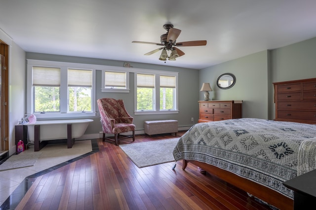 15 Brookview Dr, Bucksport, ME 04416 - bedroom featuring baseboard heating, hardwood / wood-style flooring, and a ceiling fan