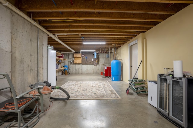 15 Brookview Dr, Bucksport, ME 04416 - unfinished basement with a water pressure tank and wine cooler