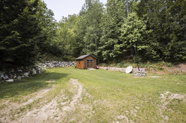 15 Brookview Dr, Bucksport, ME 04416 - view of grassy yard with a wooded view