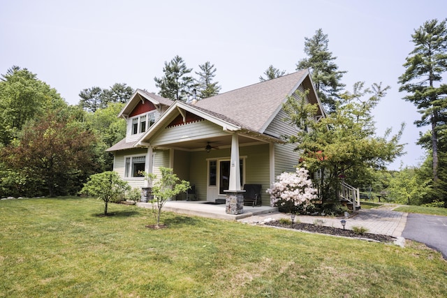 15 Brookview Dr, Bucksport, ME 04416 - craftsman house with a ceiling fan and a front lawn