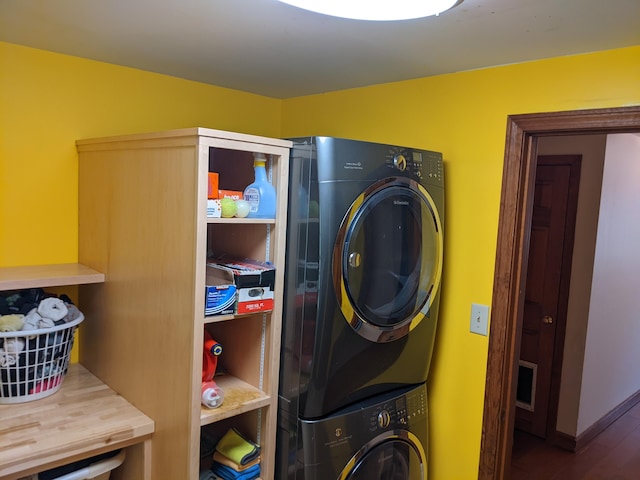 116 Point Rd, Acton, ME 04001 - washroom with stacked washer and clothes dryer and wood finished floors