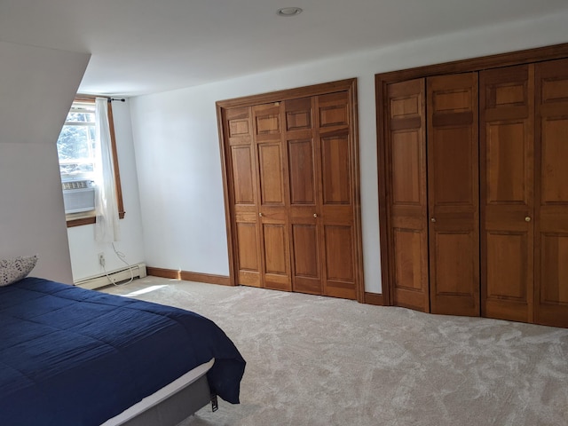 116 Point Rd, Acton, ME 04001 - bedroom with a baseboard heating unit, cooling unit, carpet floors, and multiple closets