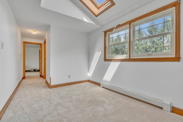 116 Point Rd, Acton, ME 04001 - carpeted spare room featuring a skylight, a baseboard radiator, and lofted ceiling
