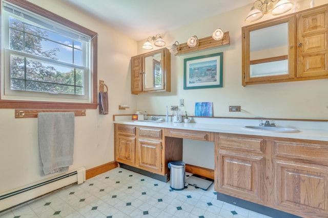 116 Point Rd, Acton, ME 04001 - bathroom featuring baseboard heating and double vanity
