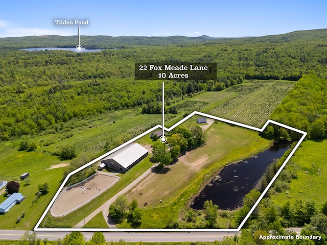 18 Fox Meade Ln, Searsmont, ME 04973 - view of property location with a nearby body of water, property boundaries highlighted, and a heavily wooded area