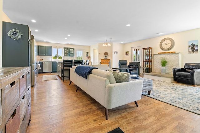 18 Fox Meade Ln, Searsmont, ME 04973 - living area featuring light wood-style flooring, recessed lighting, healthy amount of natural light, and a chandelier