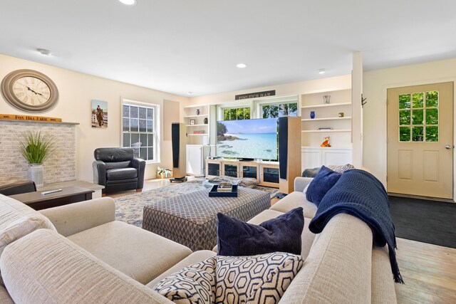 18 Fox Meade Ln, Searsmont, ME 04973 - living room featuring wood finished floors, plenty of natural light, recessed lighting, and built in features