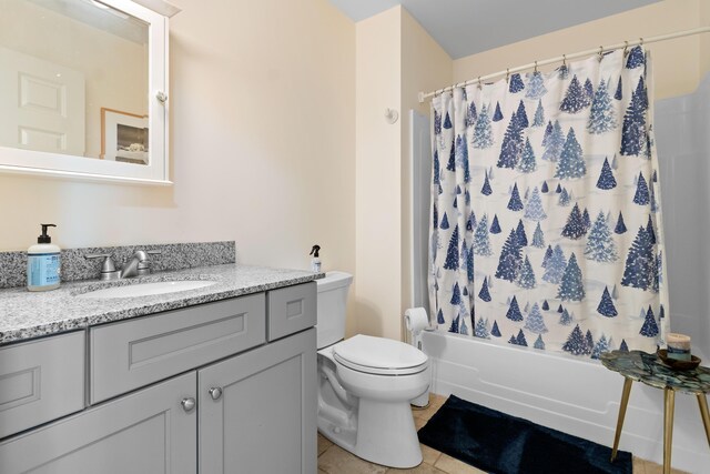 18 Fox Meade Ln, Searsmont, ME 04973 - full bath featuring vanity, toilet, tile patterned floors, and shower / tub combo with curtain