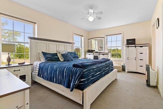 18 Fox Meade Ln, Searsmont, ME 04973 - bedroom with light colored carpet, multiple windows, and ceiling fan