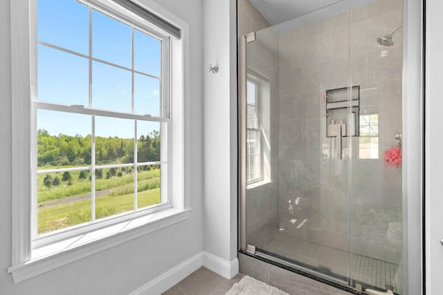 18 Fox Meade Ln, Searsmont, ME 04973 - full bath featuring baseboards, a stall shower, and tile patterned flooring