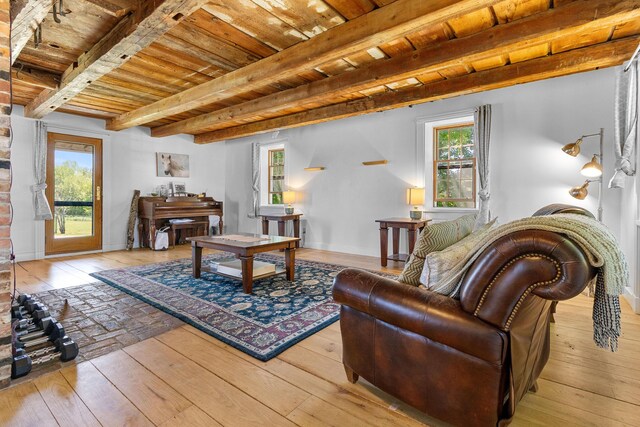 18 Fox Meade Ln, Searsmont, ME 04973 - living area featuring wooden ceiling with exposed beams and hardwood / wood-style flooring
