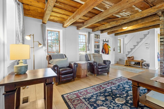 18 Fox Meade Ln, Searsmont, ME 04973 - living room featuring wooden ceiling with exposed beams, stairs, and light wood-style flooring
