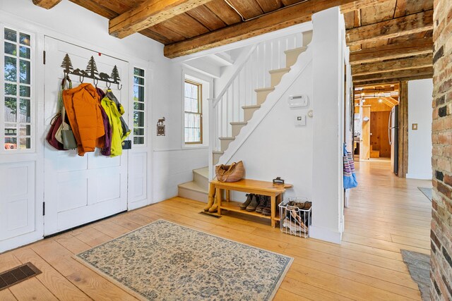 18 Fox Meade Ln, Searsmont, ME 04973 - entryway featuring wooden ceiling with exposed beams, hardwood / wood-style floors, and stairway