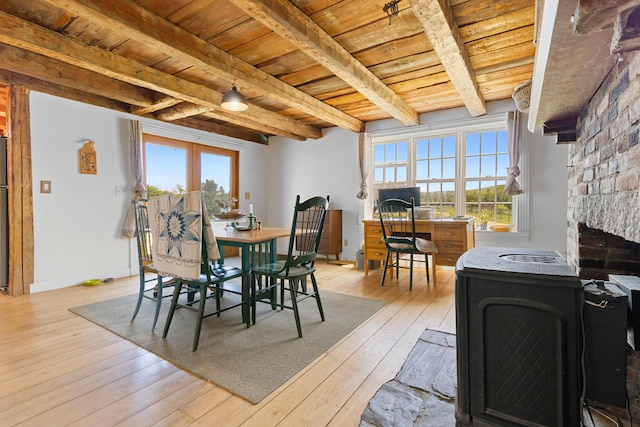 18 Fox Meade Ln, Searsmont, ME 04973 - dining area featuring wood ceiling with exposed beams, light wood-style flooring, plenty of natural light, baseboards, and a fireplace