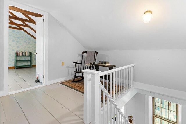 18 Fox Meade Ln, Searsmont, ME 04973 - stairway with lofted ceiling, baseboards, and wallpapered walls