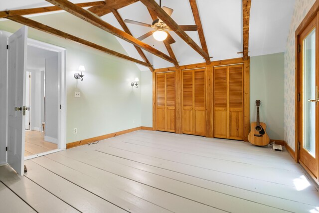 18 Fox Meade Ln, Searsmont, ME 04973 - unfurnished living room featuring beam ceiling, ceiling fan, light wood-type flooring, high vaulted ceiling, and baseboards