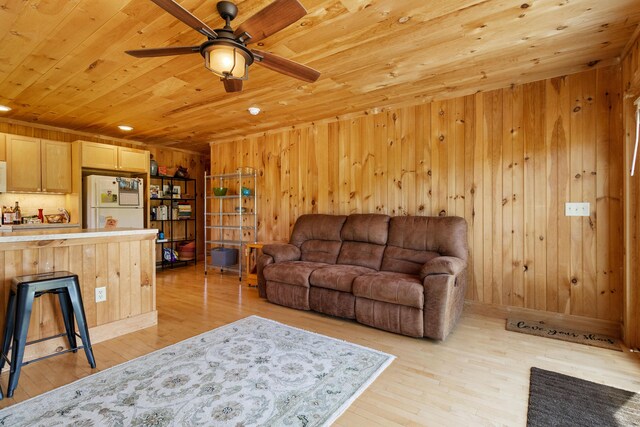 18 Fox Meade Ln, Searsmont, ME 04973 - living area featuring wooden ceiling, ceiling fan, light wood-type flooring, and wooden walls
