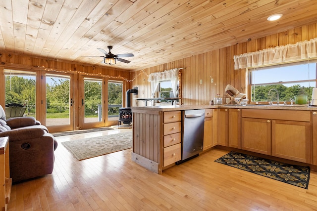 18 Fox Meade Ln, Searsmont, ME 04973 - kitchen with a wood stove, open floor plan, a sink, dishwasher, and wood ceiling