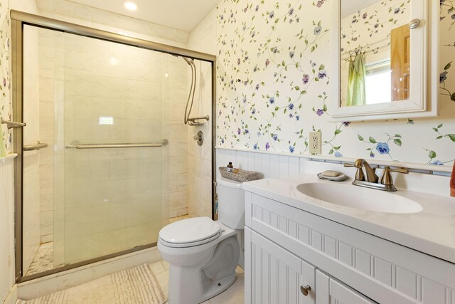 18 Fox Meade Ln, Searsmont, ME 04973 - full bath featuring toilet, a stall shower, vanity, tile patterned floors, and wallpapered walls