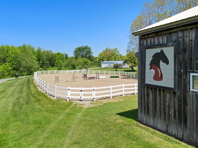 18 Fox Meade Ln, Searsmont, ME 04973 - view of green lawn featuring an enclosed horse arena