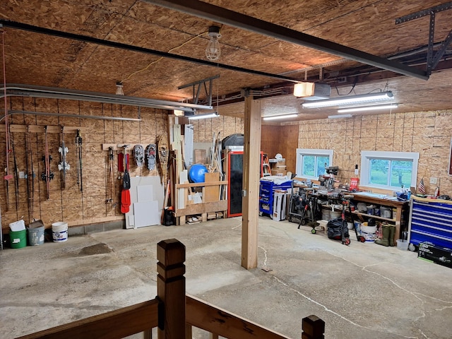 433 Hudson Rd, Corinth, ME 04427 - garage featuring a workshop area and a garage door opener