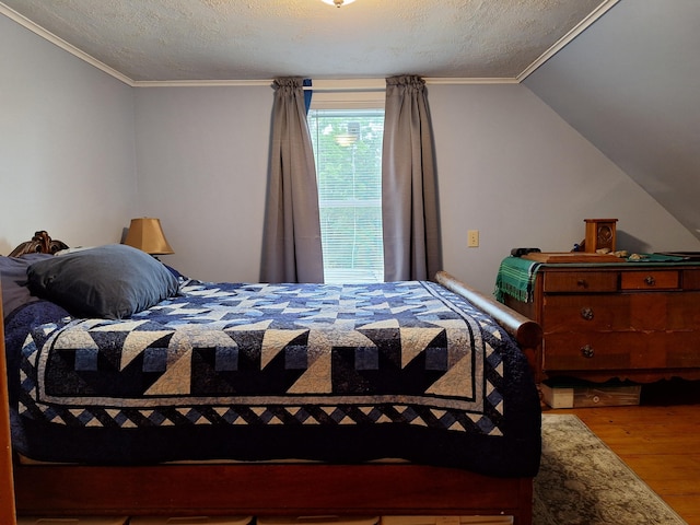 433 Hudson Rd, Corinth, ME 04427 - bedroom with wood finished floors, crown molding, and a textured ceiling