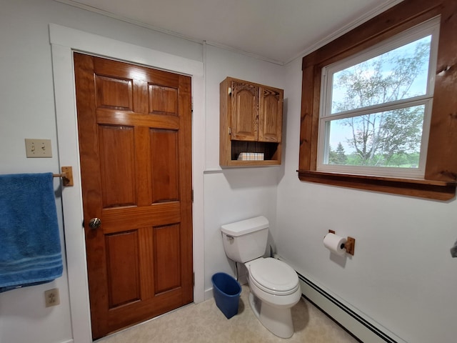 433 Hudson Rd, Corinth, ME 04427 - half bathroom with a baseboard heating unit, toilet, and crown molding
