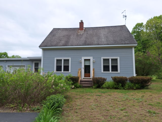 433 Hudson Rd, Corinth, ME 04427 - view of front facade featuring a chimney and a front lawn