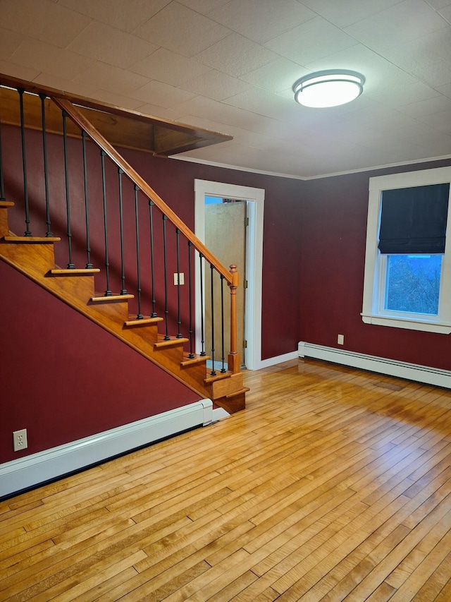 433 Hudson Rd, Corinth, ME 04427 - stairs featuring baseboard heating, wood finished floors, and baseboards