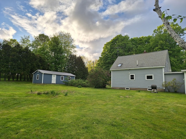 433 Hudson Rd, Corinth, ME 04427 - view of grassy yard featuring an outdoor structure and view of scattered trees