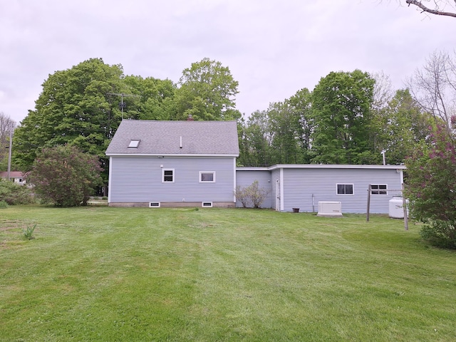 433 Hudson Rd, Corinth, ME 04427 - back of house with a yard and view of wooded area