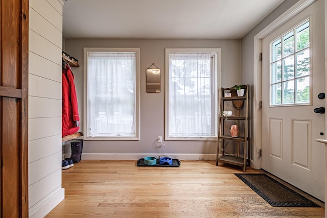 115 Caleb St, Portland, ME 04102 - doorway featuring wood finished floors and baseboards