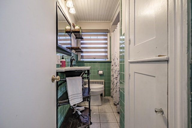 115 Caleb St, Portland, ME 04102 - bathroom with tile patterned floors, toilet, tile walls, and crown molding