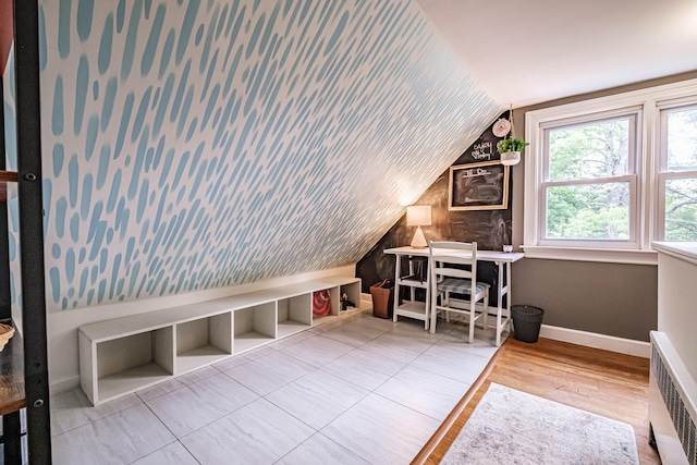 115 Caleb St, Portland, ME 04102 - home office featuring vaulted ceiling, radiator, baseboards, and wood finished floors