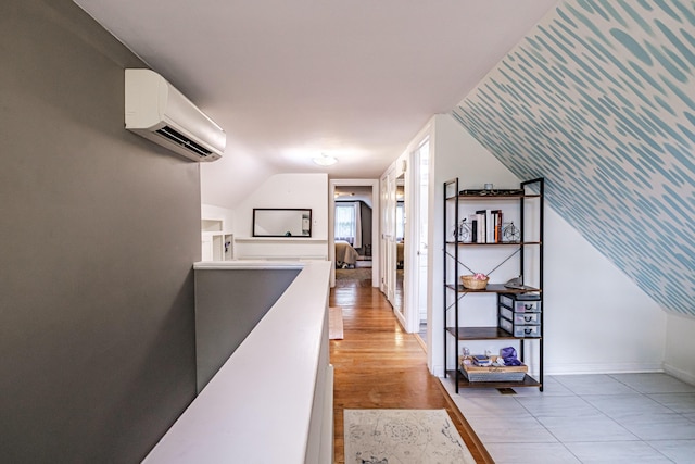 115 Caleb St, Portland, ME 04102 - hall featuring a wall unit AC, an upstairs landing, baseboards, and lofted ceiling