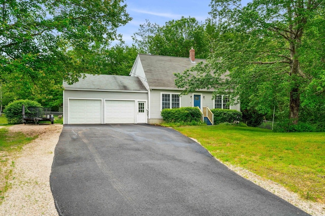 578 Little River Rd, Lebanon, ME 04027 - cape cod house with a garage, asphalt driveway, a chimney, and a front lawn