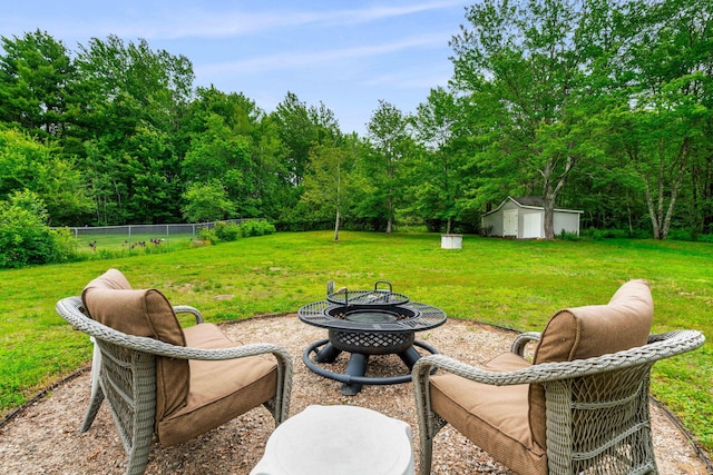 578 Little River Rd, Lebanon, ME 04027 - view of yard featuring a fire pit and a storage unit