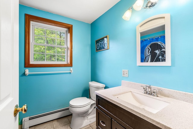 578 Little River Rd, Lebanon, ME 04027 - full bath with baseboard heating, vanity, and tile patterned flooring