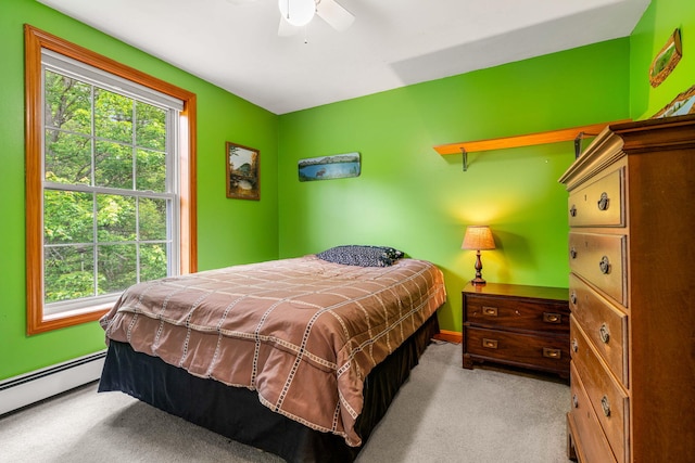 578 Little River Rd, Lebanon, ME 04027 - bedroom featuring baseboard heating, multiple windows, carpet flooring, and a ceiling fan