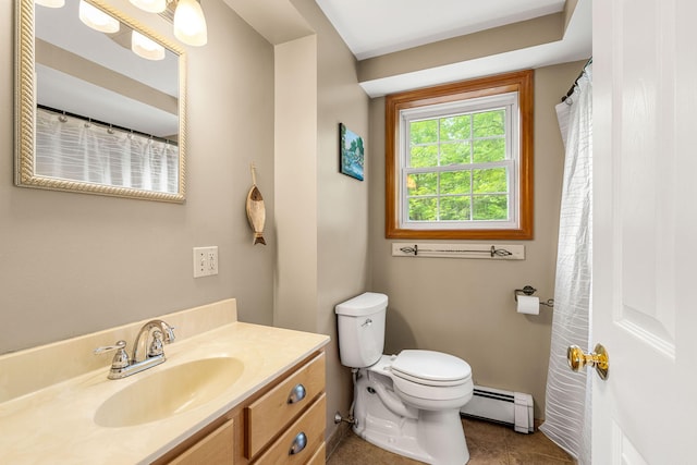 578 Little River Rd, Lebanon, ME 04027 - bathroom with baseboard heating, vanity, and tile patterned flooring