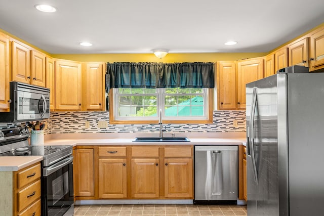 578 Little River Rd, Lebanon, ME 04027 - kitchen with stainless steel appliances, light countertops, decorative backsplash, and recessed lighting