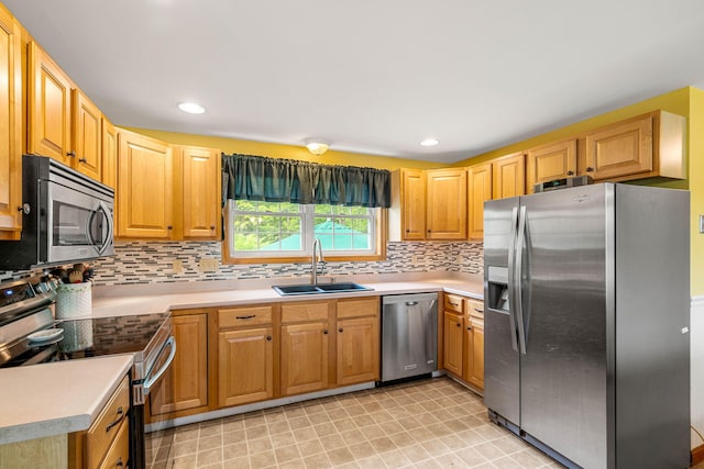 578 Little River Rd, Lebanon, ME 04027 - kitchen with appliances with stainless steel finishes, backsplash, light countertops, recessed lighting, and light flooring