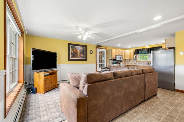578 Little River Rd, Lebanon, ME 04027 - living area featuring a baseboard radiator, wainscoting, a ceiling fan, and recessed lighting