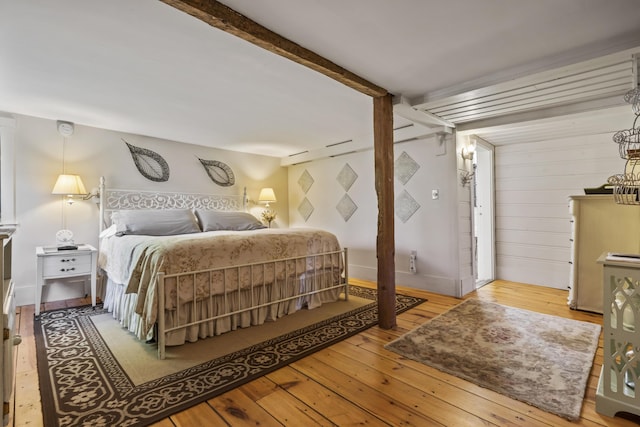 9 Dry Point Dr, Rome, ME 04963 - bedroom featuring wood-type flooring, beam ceiling, and baseboards