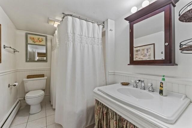 9 Dry Point Dr, Rome, ME 04963 - full bath with a baseboard radiator, toilet, tile patterned flooring, a wainscoted wall, and a shower with curtain